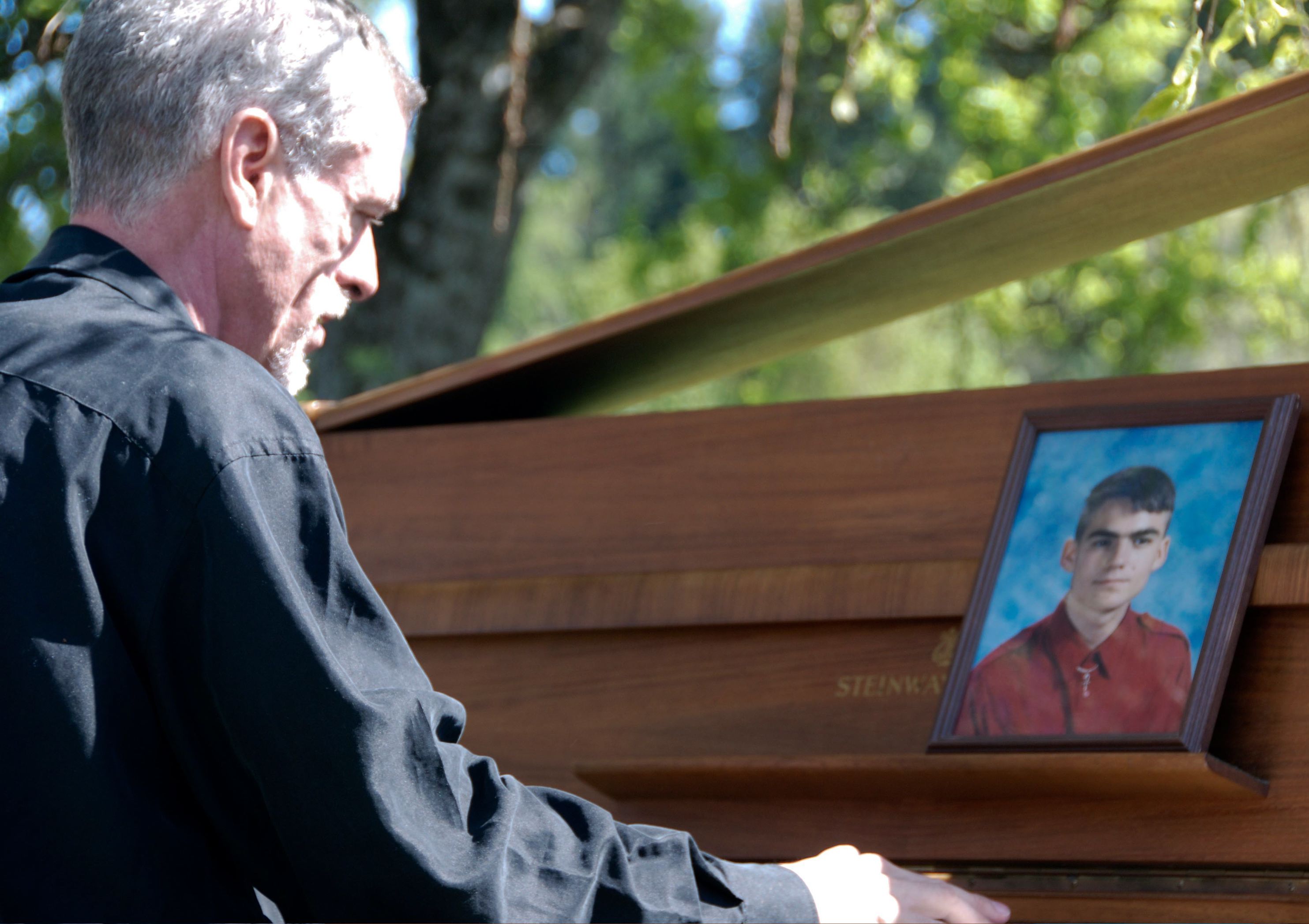 Steve Schalchlin playing John Lennon's Piano